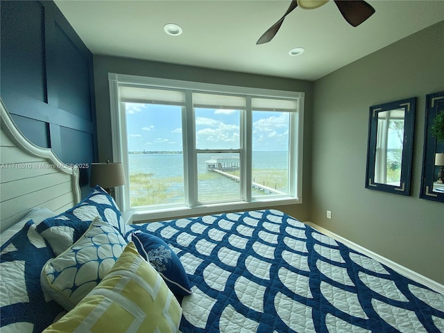 424 Lake Mirror Dr, Lake Placid, FL 33852 - bedroom featuring a water view, a ceiling fan, baseboards, and recessed lighting