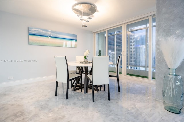 dining room with a wall of windows