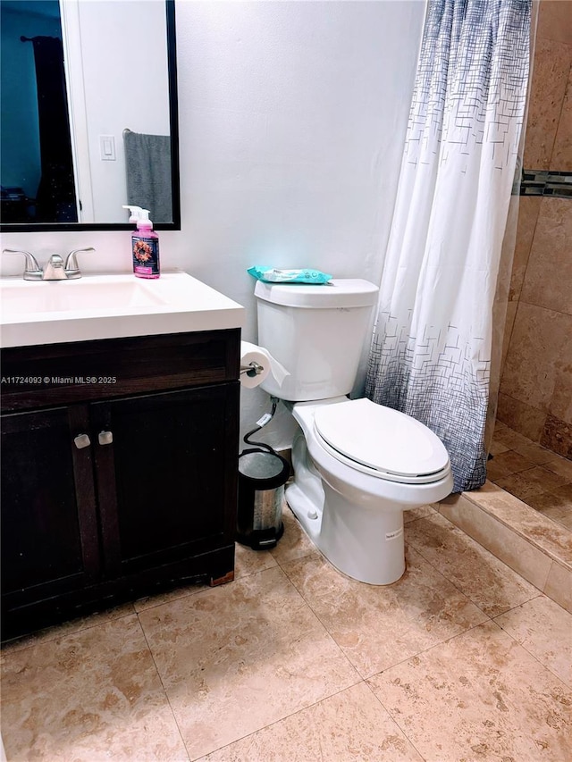 bathroom featuring vanity, toilet, and walk in shower