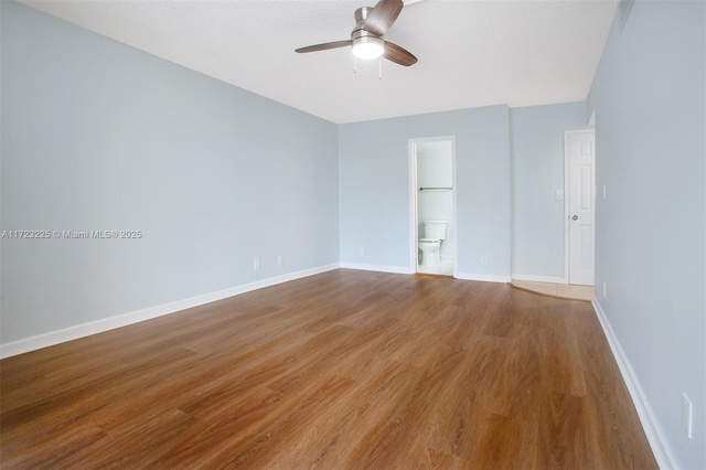 unfurnished room with ceiling fan and hardwood / wood-style floors