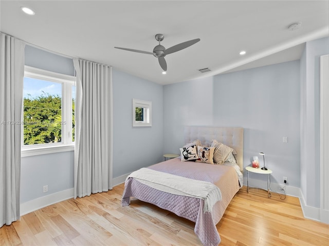 bedroom featuring ceiling fan and light hardwood / wood-style flooring