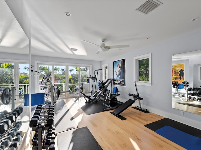 exercise room featuring ceiling fan, hardwood / wood-style floors, and french doors