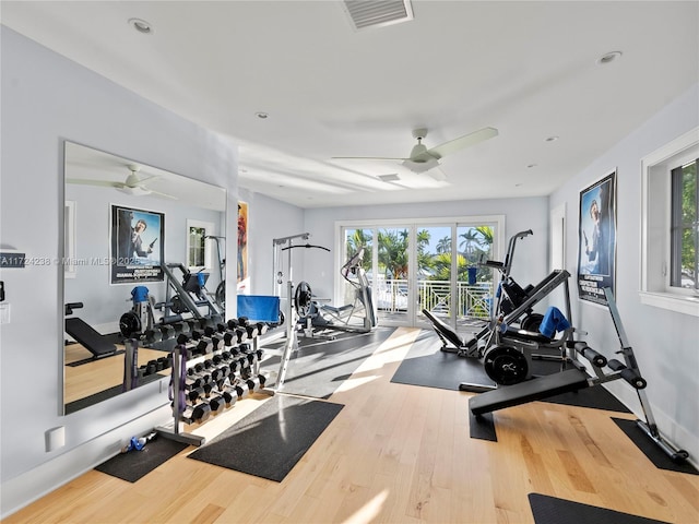 workout area featuring french doors, ceiling fan, and wood-type flooring