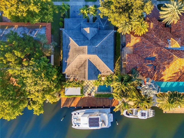 birds eye view of property with a water view