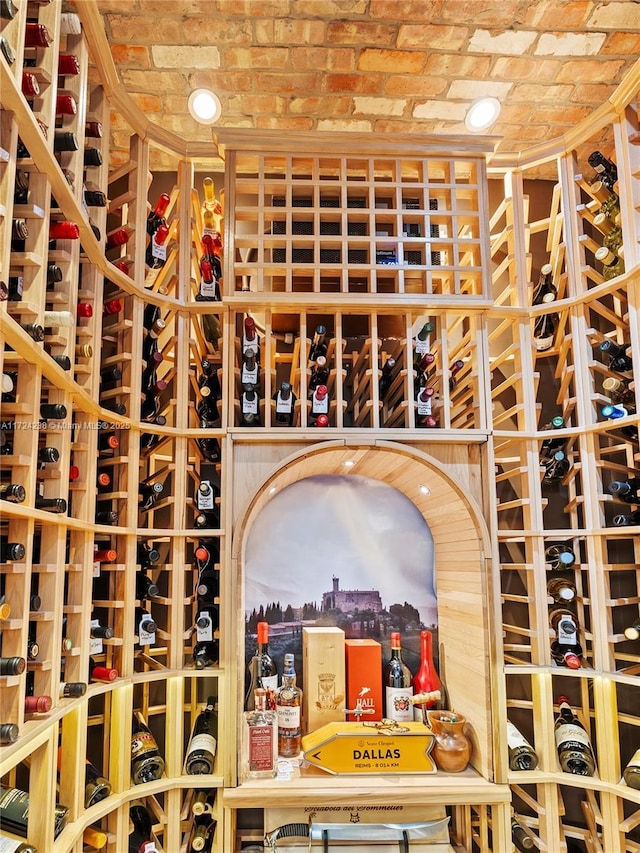 wine area featuring brick ceiling