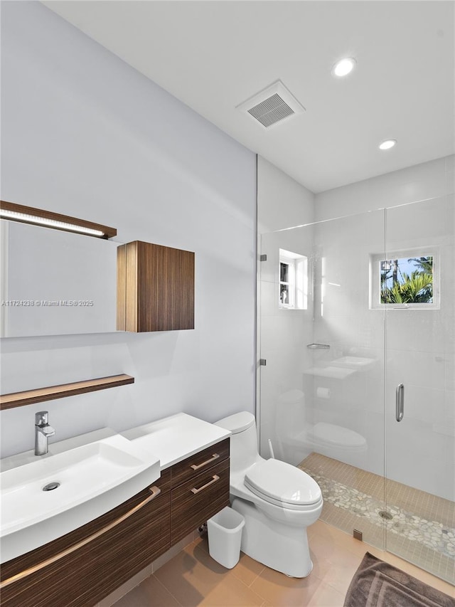 bathroom featuring toilet, walk in shower, tile patterned floors, and vanity