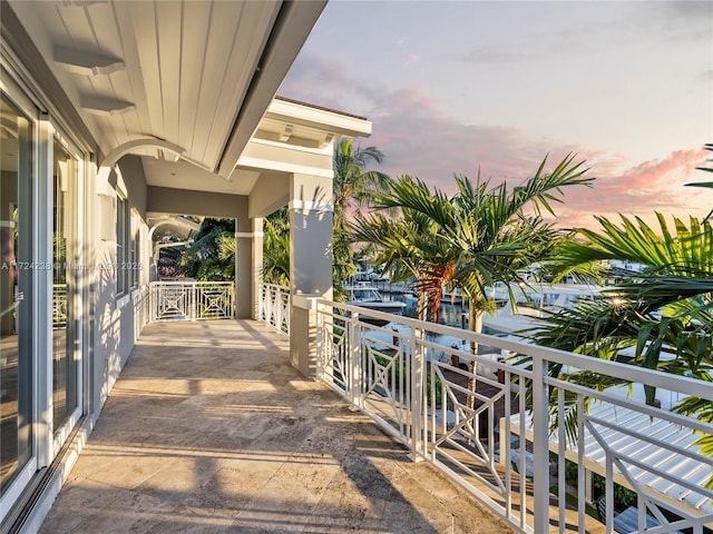 patio terrace at dusk with a balcony