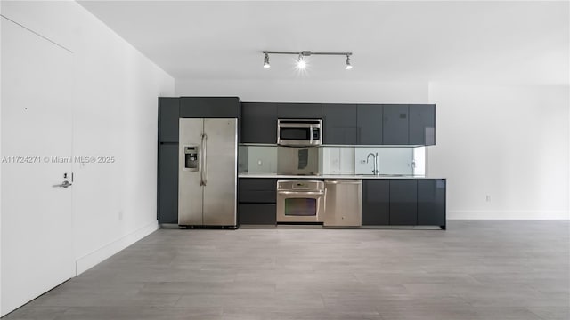 kitchen featuring stainless steel appliances and sink