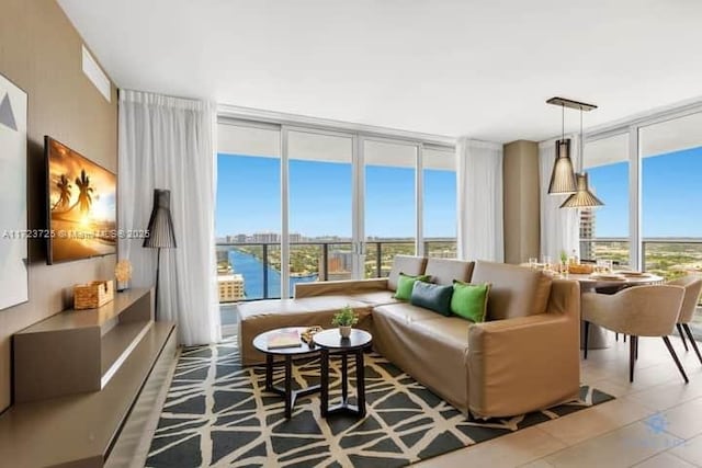 sunroom / solarium featuring a water view and a wealth of natural light