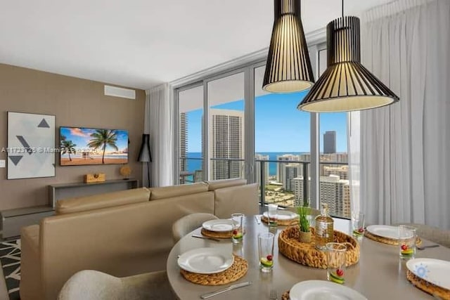 dining area featuring a wall of windows