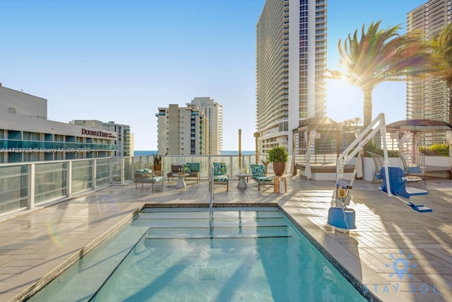 view of swimming pool featuring a patio area