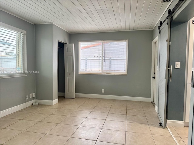 unfurnished bedroom with light tile patterned floors, multiple windows, and wood ceiling