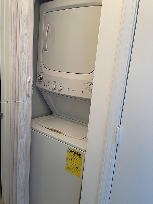 laundry area featuring stacked washer and dryer