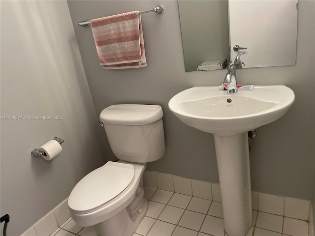 bathroom featuring tile patterned flooring and toilet