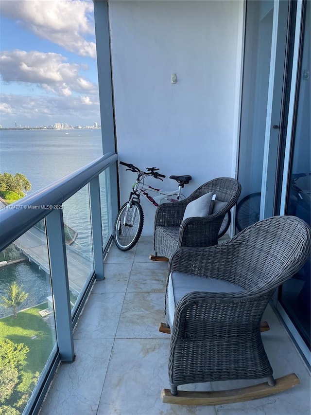 balcony featuring a water view