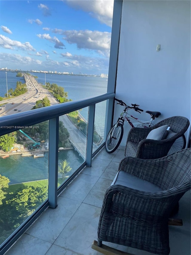 balcony featuring a water view