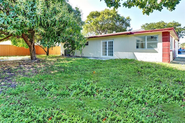 view of yard with french doors