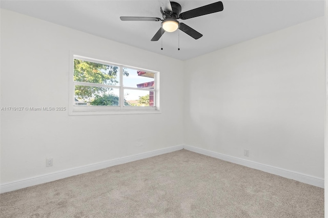 unfurnished room featuring ceiling fan and light carpet