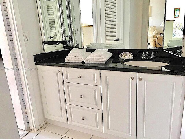 bathroom featuring tile patterned flooring and vanity