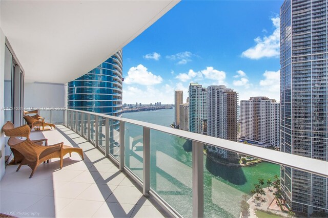 balcony featuring a water view