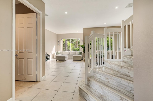 stairs featuring tile patterned floors