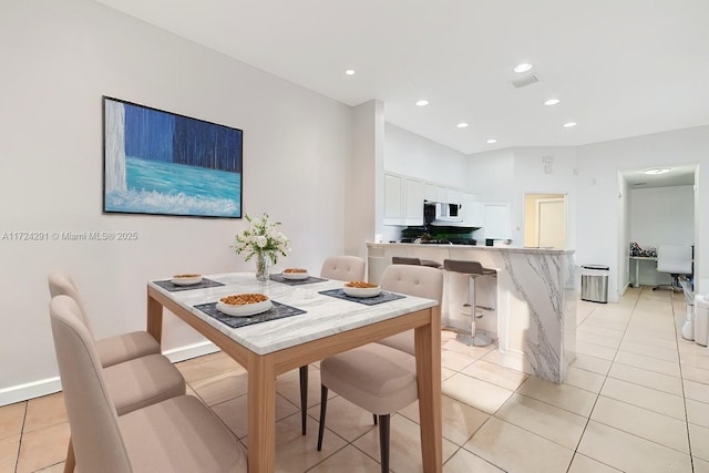 dining area featuring light tile patterned floors