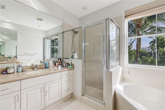 bathroom featuring tile patterned flooring, plus walk in shower, and vanity