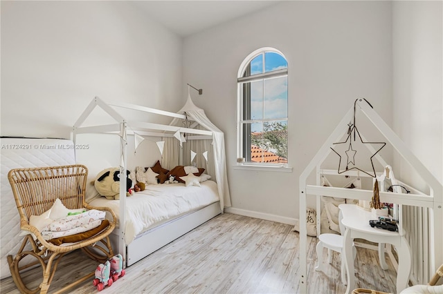 bedroom with light wood-type flooring