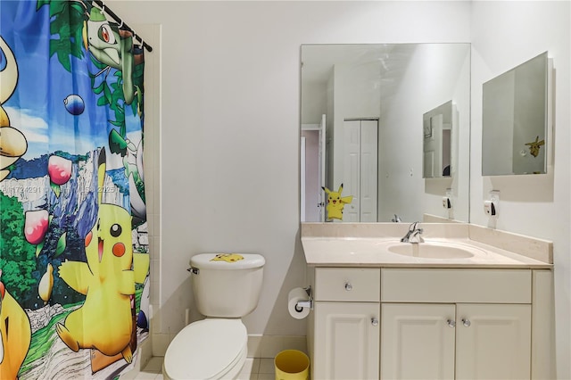 bathroom featuring walk in shower, tile patterned floors, vanity, and toilet