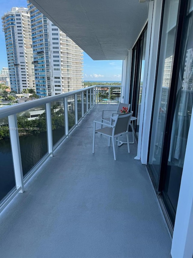 balcony featuring a water view