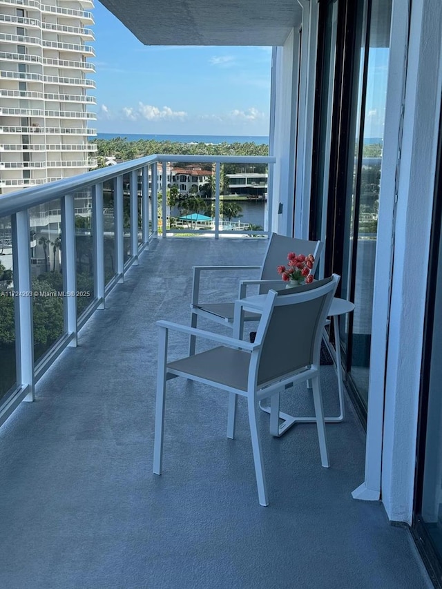 balcony featuring a water view