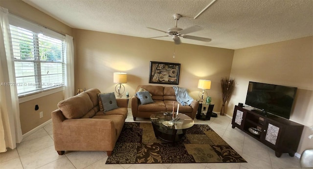 tiled living room with a textured ceiling and ceiling fan