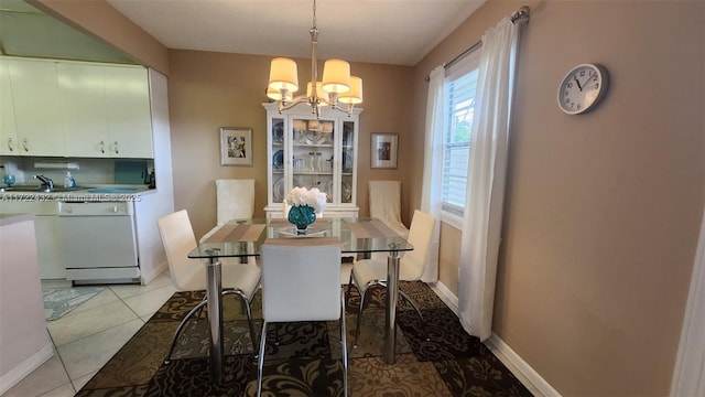 dining space featuring an inviting chandelier, light tile patterned flooring, and sink