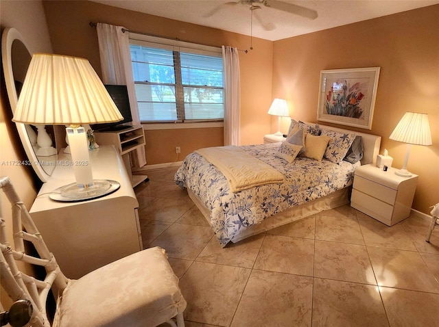 tiled bedroom with ceiling fan