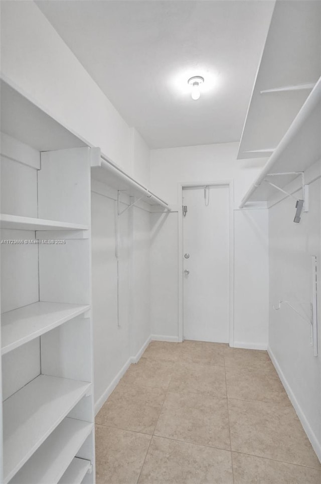 walk in closet featuring tile patterned floors