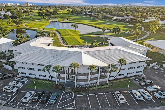 bird's eye view with a water view and golf course view