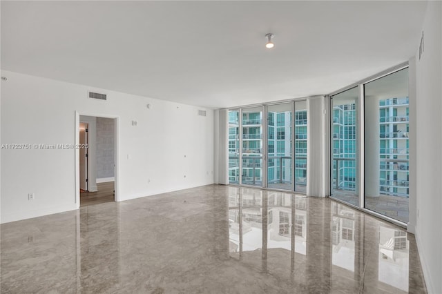 empty room featuring floor to ceiling windows