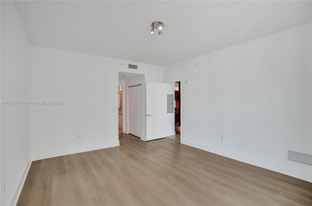 unfurnished room featuring light wood-type flooring