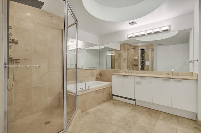 bathroom with vanity and plus walk in shower