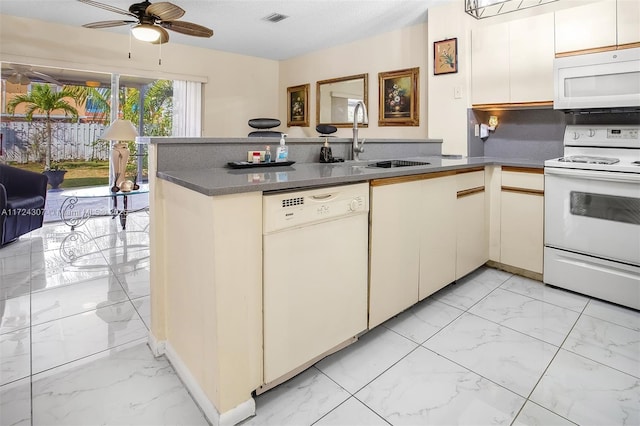 kitchen with white appliances, visible vents, marble finish floor, and a peninsula