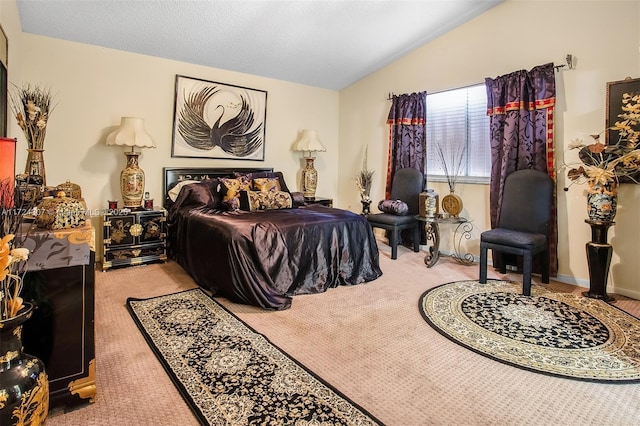 bedroom with lofted ceiling, light carpet, and a textured ceiling