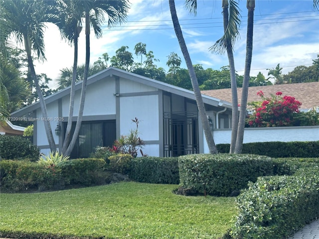 view of home's exterior featuring a yard