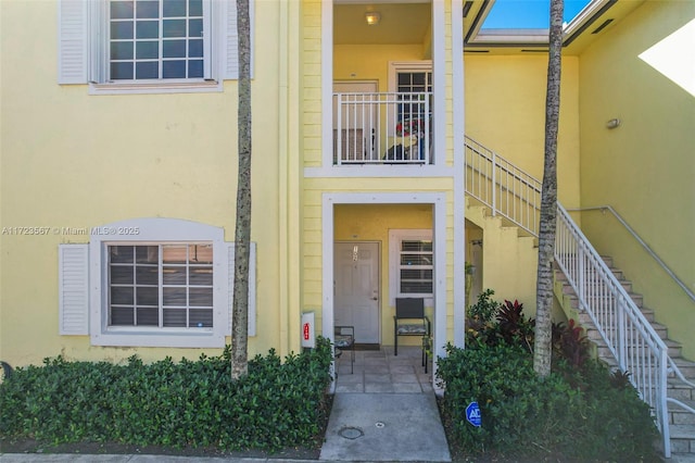 property entrance with a balcony