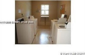 clothes washing area with washer and dryer