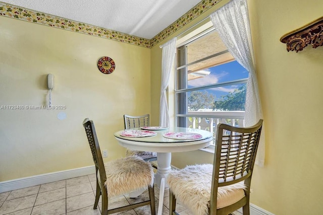 dining space with light tile patterned floors