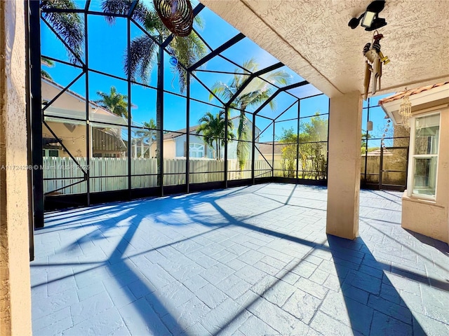 view of patio / terrace featuring a lanai