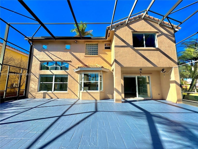 rear view of house with glass enclosure