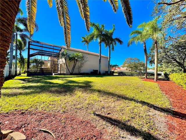 view of yard with a lanai