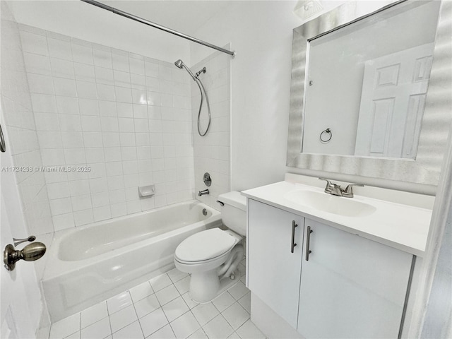 full bathroom featuring vanity, tile patterned floors, tiled shower / bath combo, and toilet