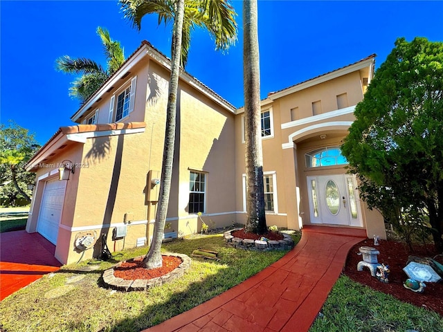 view of front of home with a garage